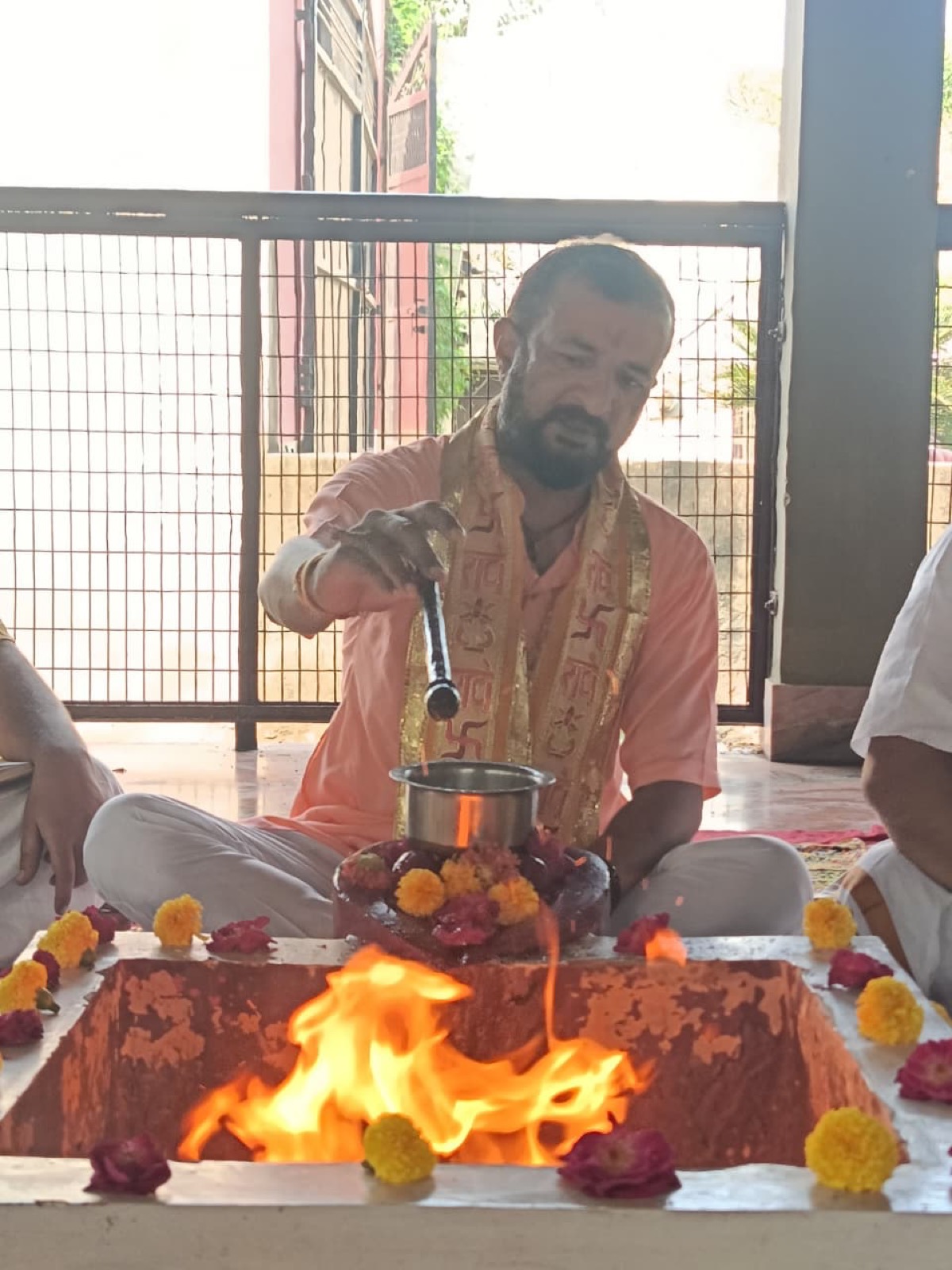 Three Brahmins seated at the fire